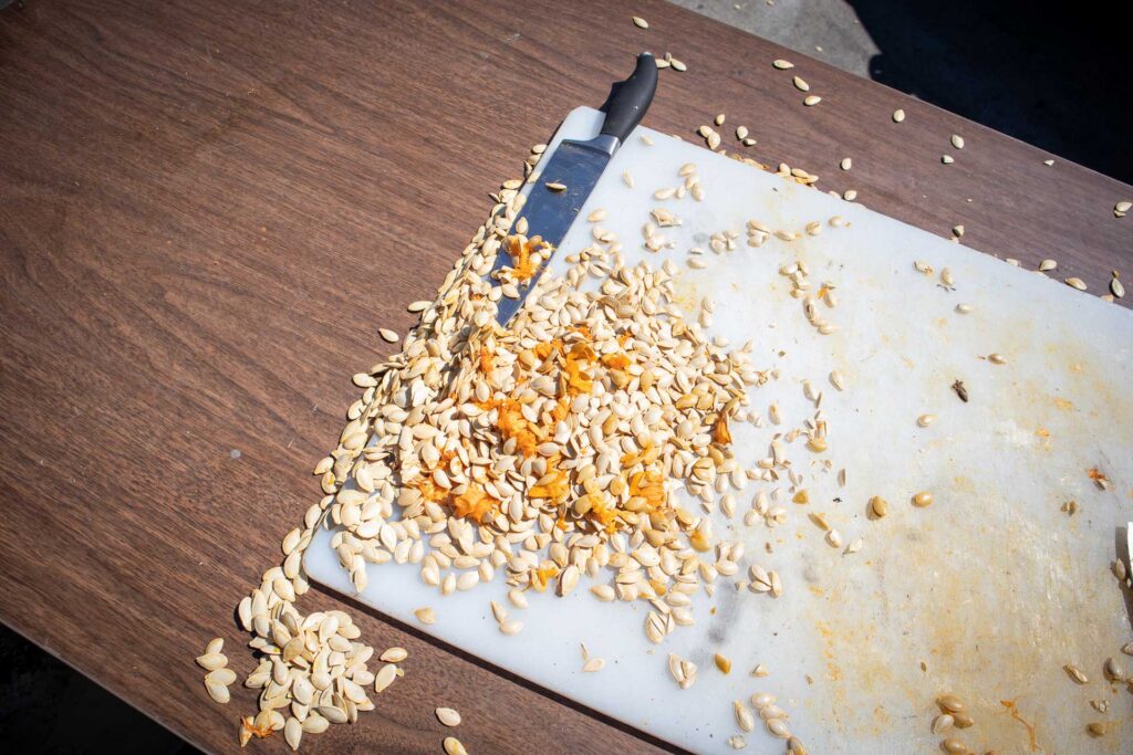 pumpkin seeds on a cutting board