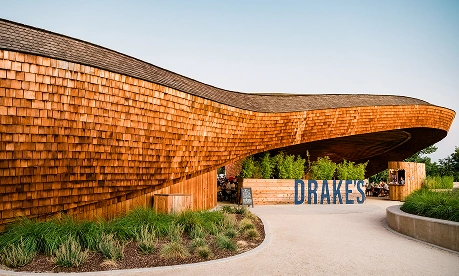 Drake's brewery entrance with a wooden exterior and blue signage