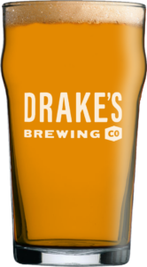 Drake's Brewing Co. print glass filled with amber ale